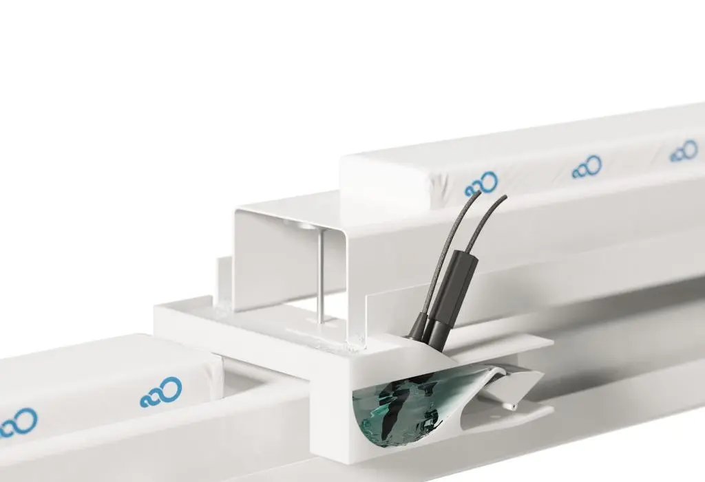 Sigrow DrainSense wireless drain sensor in a greenhouse gutter